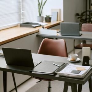 Modern Office Workspace Showing Laptops and Documents for Team Productivity